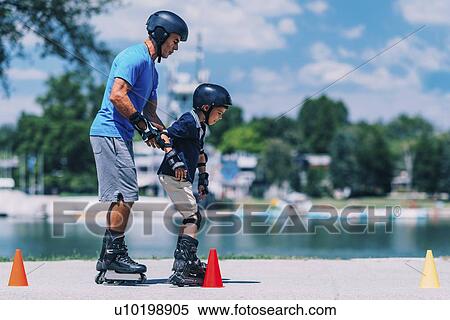 Grandfather teaching grandson to roller skate View Large Photo Image Stock Photography - Grandfather teaching grandson to roller skate. Fotosearch