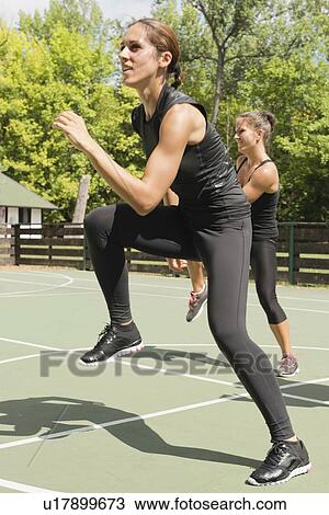 Group exercise class outdoors View Large Photo Image Stock Image - Group exercise class outdoors. Fotosearch
