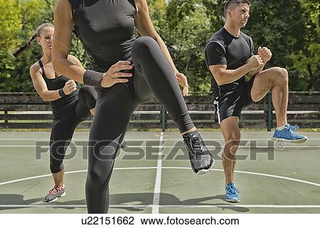 Group exercise class outdoors View Large Photo Image Stock Image - Group exercise class outdoors. Fotosearch