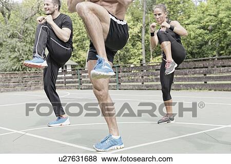 Group exercise class outdoors View Large Photo Image Stock Photo - Group exercise class outdoors. Fotosearch