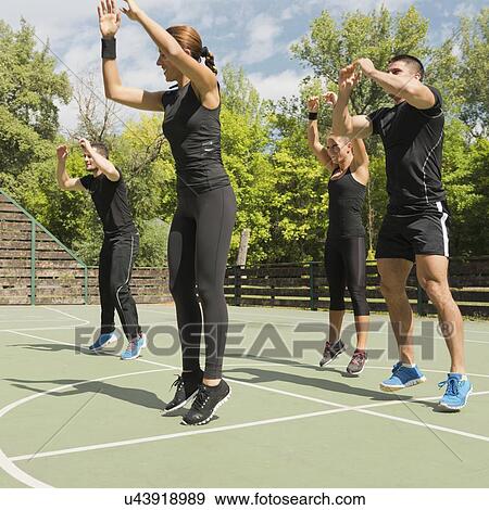 Group exercise class outdoors View Large Photo Image Stock Photo - Group exercise class outdoors. Fotosearch