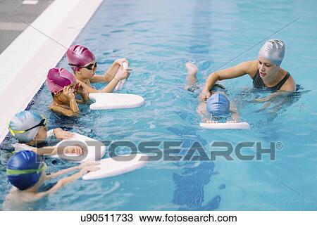 Group swimming lesson View Large Photo Image Stock Image - Group swimming lesson. Fotosearch