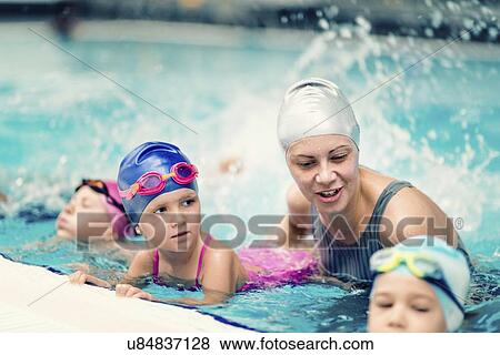Stock Photo - Group swimming lesson. Fotosearch