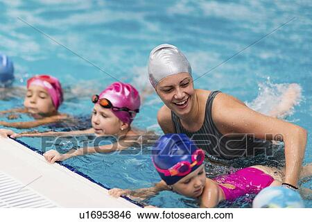 Stock Photograph - Group swimming lesson. Fotosearch