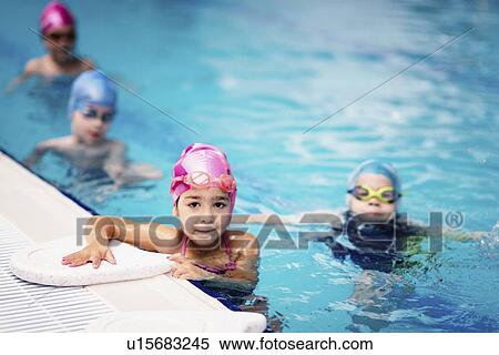 Stock Photography - Group swimming lesson. Fotosearch