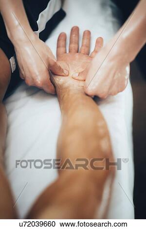 Stock Image - Hand massage. Fotosearch