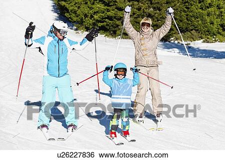 Happy family skiing View Large Photo Image Stock Photograph - Happy family skiing. Fotosearch
