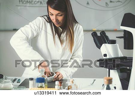 Homeopath preparing herbal remedies View Large Photo Image Stock Image - Homeopath preparing herbal remedies. Fotosearch