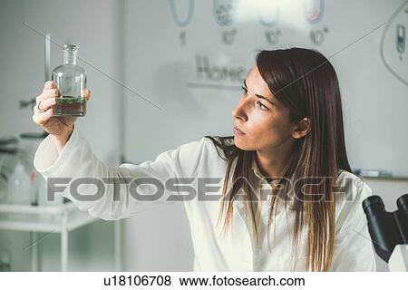 Stock Photo - Homeopath preparing herbal remedies. Fotosearch