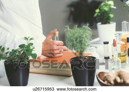 Stock Image - Homeopathic remedy preparation. Fotosearch