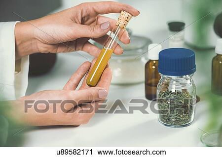 Stock Image - Homeopathic remedy preparation. Fotosearch