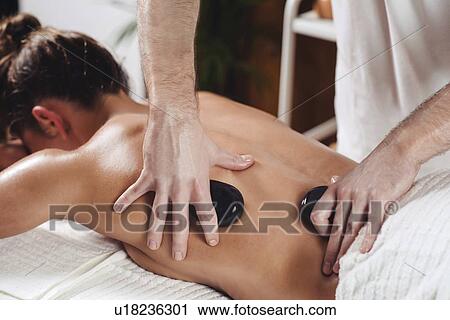 Hot stone massage View Large Photo Image Stock Image - Hot stone massage. Fotosearch