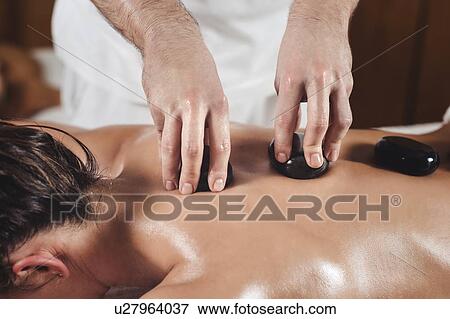 Stock Photo - Hot stone massage. Fotosearch