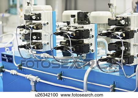 Stock Image - Hydraulic blocks for oil distribution. Fotosearch