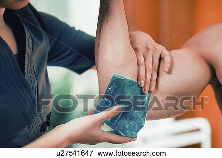 Ice pack on painful elbow View Large Photo Image Stock Photo - Ice pack on painful elbow. Fotosearch