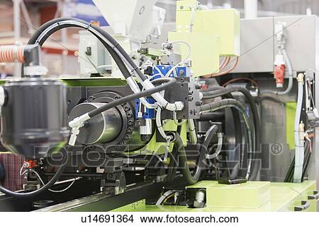 Picture - Industrial plastic injection moulding machine. Fotosearch