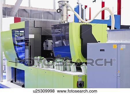 Stock Photo - Industrial plastic injection moulding machine. Fotosearch