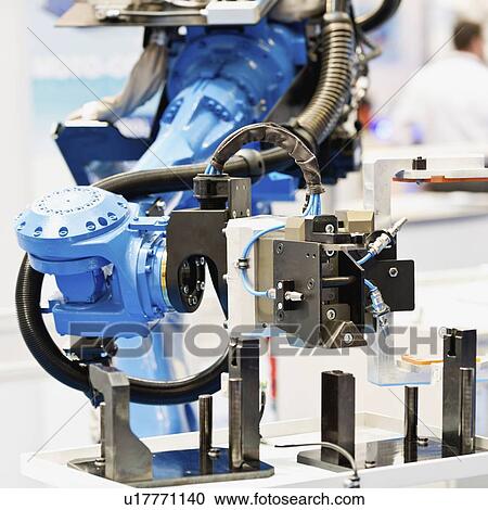 Stock Image - Industrial robotic arm. Fotosearch