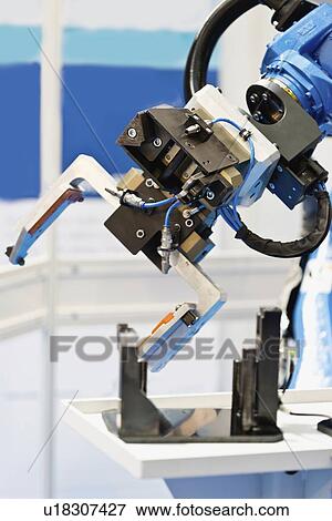 Stock Photo - Industrial robotic arm. Fotosearch
