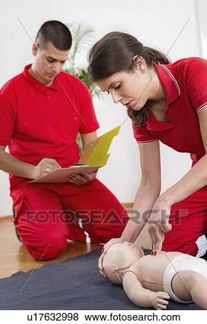 Stock Photo - Infant cardiopulmonary resuscitation training. Fotosearch