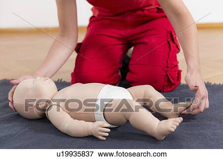 Infant cardiopulmonary resuscitation training View Large Photo Image Stock Photo - Infant cardiopulmonary resuscitation training. Fotosearch