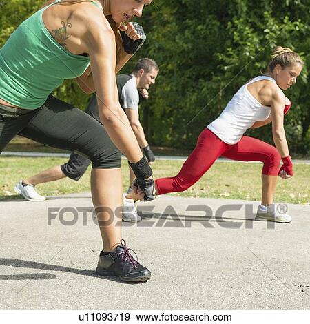Stock Photo - Kickboxing training outdoors. Fotosearch