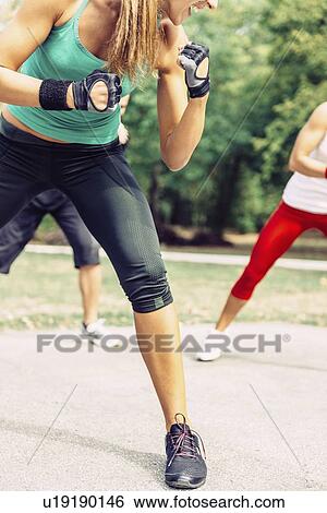 Stock Photograph - Kickboxing training outdoors. Fotosearch