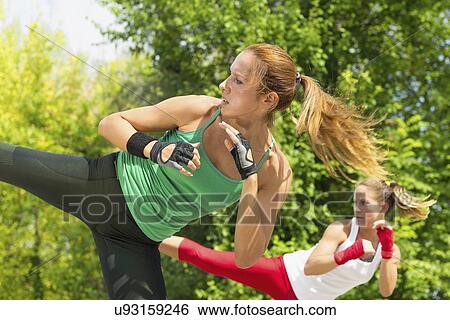 Stock Photograph - Kickboxing training outdoors. Fotosearch