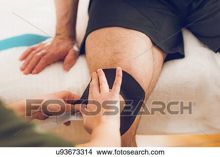 Kinesio tape application View Large Photo Image Picture - Kinesio tape application. Fotosearch