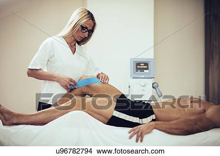 Kinesio tape application View Large Photo Image Picture - Kinesio tape application. Fotosearch