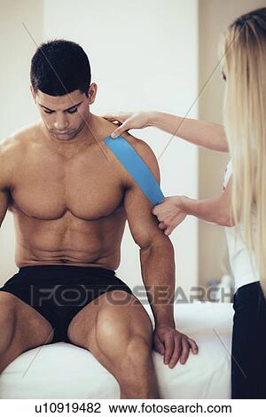 Kinesio tape application View Large Photo Image Stock Image - Kinesio tape application. Fotosearch