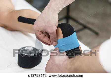Kinesio tape application View Large Photo Image Stock Image - Kinesio tape application. Fotosearch