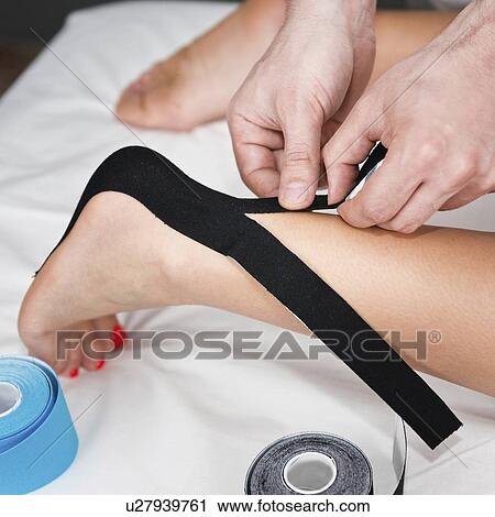 Kinesio tape application View Large Photo Image Stock Image - Kinesio tape application. Fotosearch