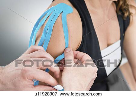 Stock Photo - Kinesio tape application. Fotosearch