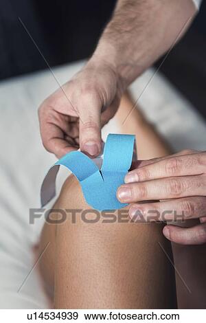 Stock Photo - Kinesio tape application. Fotosearch