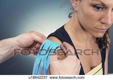 Stock Photo - Kinesio tape application. Fotosearch
