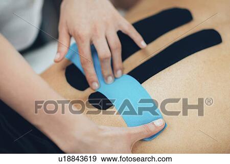 Stock Photo - Kinesio tape application. Fotosearch