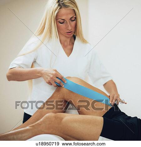 Stock Photo - Kinesio tape application. Fotosearch