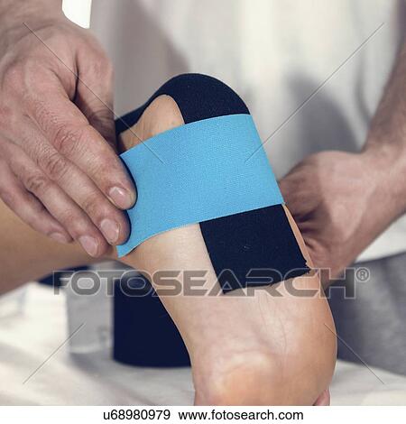 Stock Photo - Kinesio tape application. Fotosearch