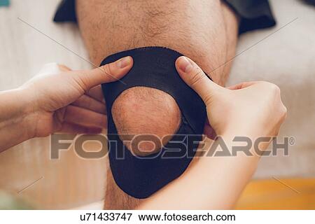 Kinesio tape application View Large Photo Image Stock Photo - Kinesio tape application. Fotosearch