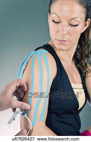 Stock Photo - Kinesio tape application. Fotosearch