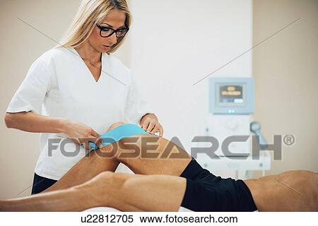 Stock Photography - Kinesio tape application. Fotosearch