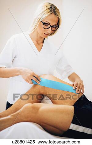 Stock Photography - Kinesio tape application. Fotosearch