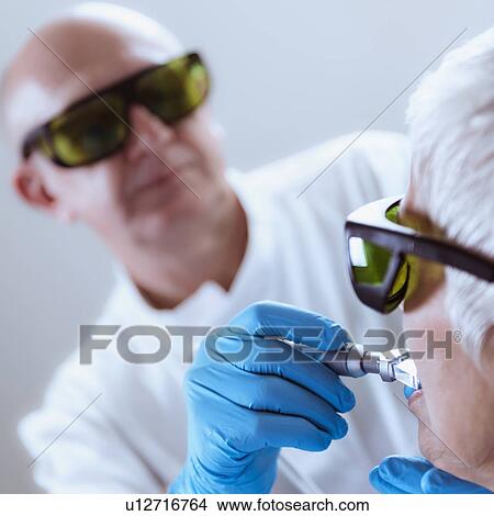 Picture - Laser teeth whitening. Fotosearch