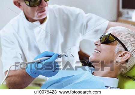 Laser teeth whitening View Large Photo Image Stock Image - Laser teeth whitening. Fotosearch