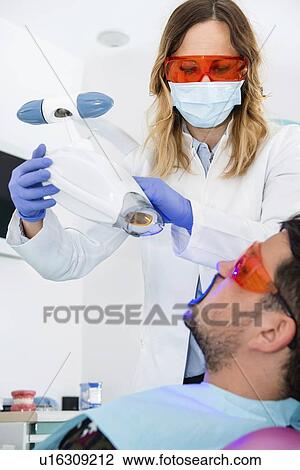 Laser teeth whitening View Large Photo Image Stock Image - Laser teeth whitening. Fotosearch