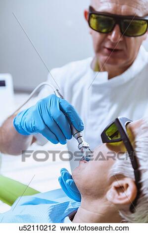 Laser teeth whitening View Large Photo Image Stock Image - Laser teeth whitening. Fotosearch