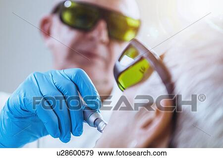 Stock Photo - Laser teeth whitening. Fotosearch