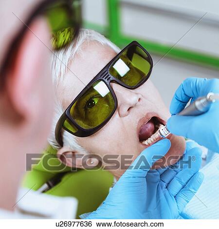 Laser teeth whitening View Large Photo Image Stock Photograph - Laser teeth whitening. Fotosearch
