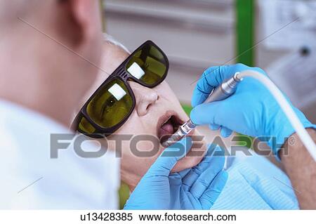 Stock Photography - Laser teeth whitening. Fotosearch